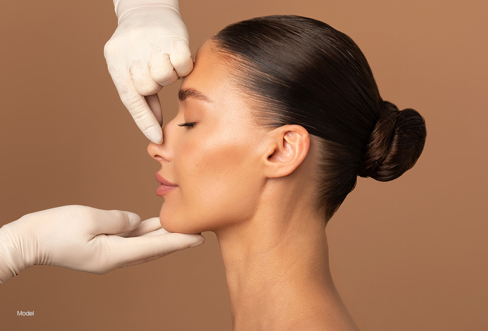 Woman having her nose examined 
